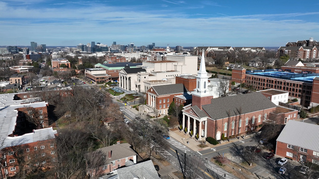 Aerial view of a church with a prominent steeple surrounded by brick buildings and urban streets in Nashville Tennessee United States. Aerial view of a church with a prominent steeple surrounded by brick buildings and urban streets in Nashville Tennessee United States.