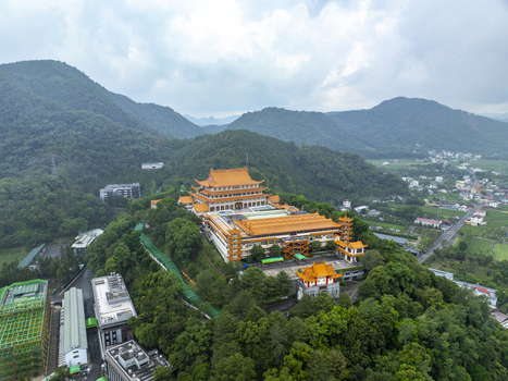 Aerial view of the Chung Tai Chan Monastery with its distinctive golden roofs nestled among lush green mountains in Puli Township Nantou County Taiwan. Aerial view of the Chung Tai Chan Monastery with its distinctive golden roofs nestled among lush green mountains in Puli Township Nantou County Taiwan.