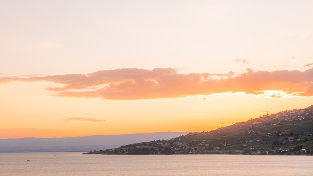 View of the terraced vineyards of the Lavaux region overlooking Lake Geneva at sunset in Bourg en Lavaux Vaud Switzerland. View of the terraced vineyards of the Lavaux region overlooking Lake Geneva at sunset in Bourg en Lavaux Vaud Switzerland.
