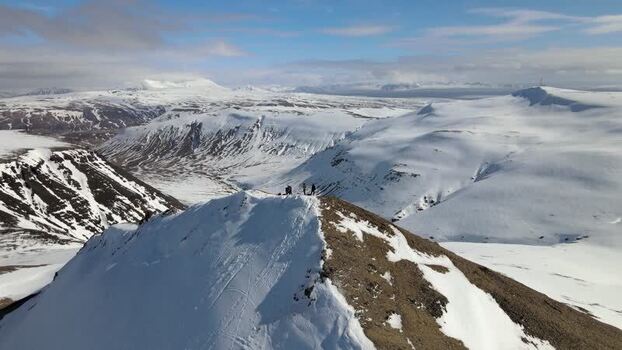 Aerial view of hikers on the Moskardshnjukar Trail peaks Iceland. Aerial view of hikers on the Moskardshnjukar Trail peaks Iceland.