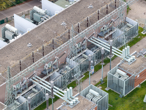 Aerial view of Umspannwerk Reuter power substation featuring high voltage transformers metal pylons and electrical infrastructure in Berlin Berlin Germany.