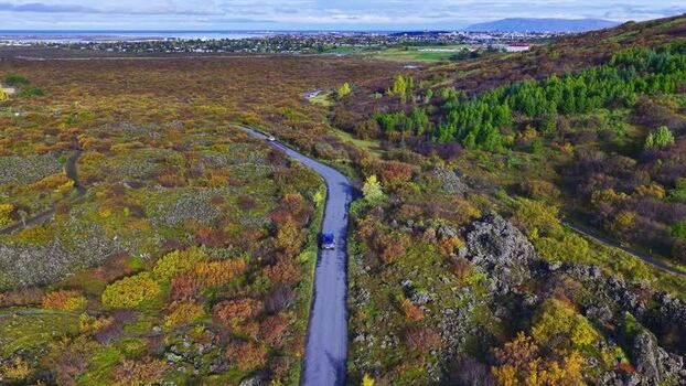 Aerial view of road winding through autumn landscape in Iceland. Aerial view of road winding through autumn landscape in Iceland.