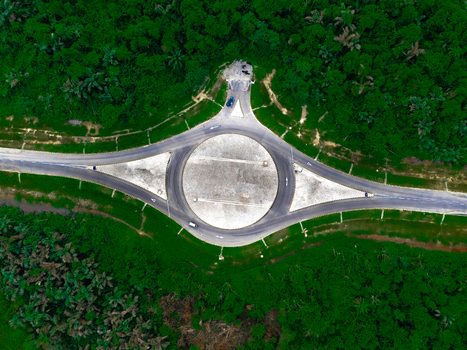 Aerial view of the roundabout on Bonny Island surrounded by dense tropical forest in Bonny Town Rivers Nigeria. Aerial view of the roundabout on Bonny Island surrounded by dense tropical forest in Bonny Town Rivers Nigeria.