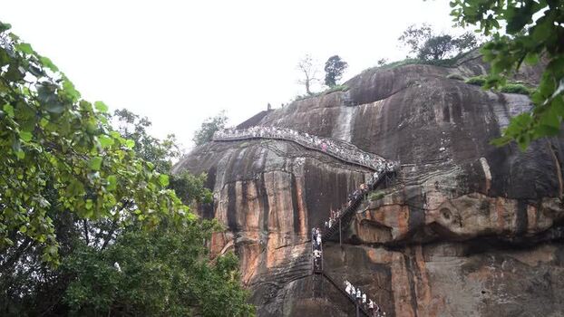 View of tourists climbing the stairs of Sigiriya rock Sri Lanka. View of tourists climbing the stairs of Sigiriya rock Sri Lanka.
