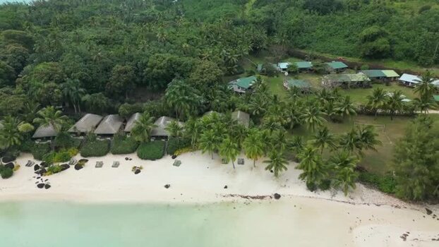 Aerial view of a tropical beach resort and palm trees Cook Islands. Aerial view of a tropical beach resort and palm trees Cook Islands.