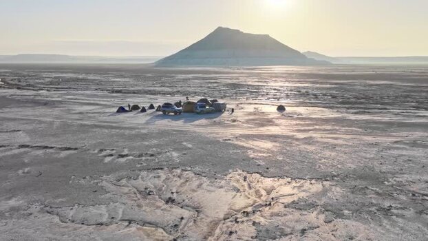 Aerial view of a campsite and off road vehicles Kazakhstan. Aerial view of a campsite and off road vehicles Kazakhstan.