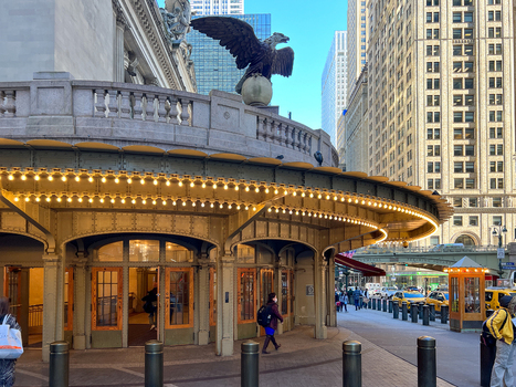 New York United States 14 May 2026 View of Grand Central Terminal exterior featuring the iconic eagle statue and illuminated canopy with people walking on the sidewalk. New York United States 14 May 2026 View of Grand Central Terminal exterior featuring the iconic eagle statue and illuminated canopy with people walking on the sidewalk.