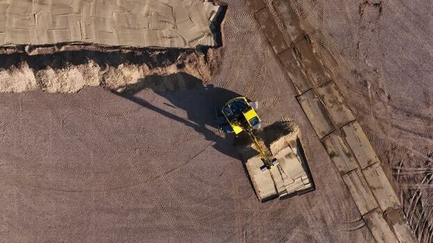 Aerial view of excavator on construction site in Netherlands.