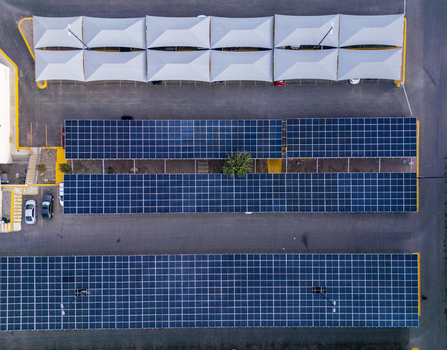 Aerial view of solar panels installed over a parking lot with shaded structures in Chihuahua Chihuahua Mexico. Aerial view of solar panels installed over a parking lot with shaded structures in Chihuahua Chihuahua Mexico.