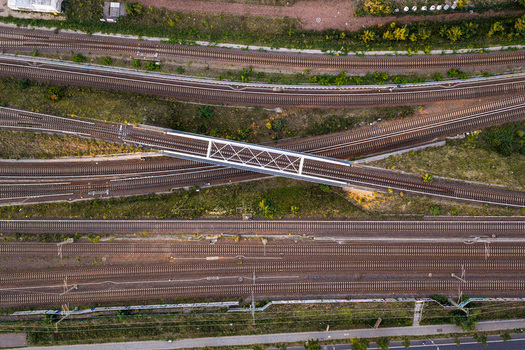 Aerial view of the Ostkreuz railway junction featuring intersecting tracks and a bridge in Berlin Berlin Germany. Aerial view of the Ostkreuz railway junction featuring intersecting tracks and a bridge in Berlin Berlin Germany.