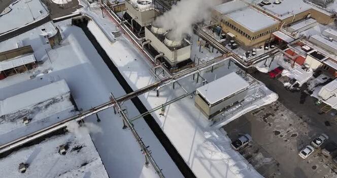 Aerial view of an industrial facility with cooling towers United States. Aerial view of an industrial facility with cooling towers United States.