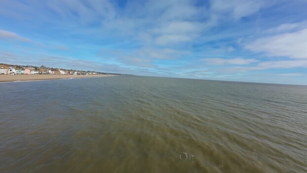 Aerial FPV view of Aldeburgh Beach and its white lighthouse United Kingdom. Aerial FPV view of Aldeburgh Beach and its white lighthouse United Kingdom.
