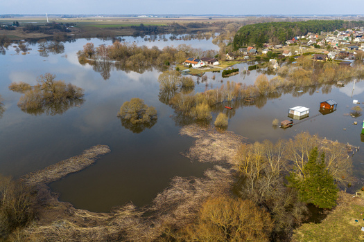Kedainiai Lithuania 17 March 2026 Aerial view of flooded residential houses and submerged trees in a rural landscape during the spring flood season. Kedainiai Lithuania 17 March 2026 Aerial view of flooded residential houses and submerged trees in a rural landscape during the spring flood season.