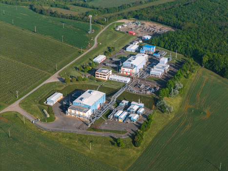 Aerial view of UGS Damborice underground gas storage facility with industrial buildings and pipelines surrounded by green fields and forests Damborice South Moravian Region Czechia. Aerial view of UGS Damborice underground gas storage facility with industrial buildings and pipelines surrounded by green fields and forests Damborice South Moravian Region Czechia.