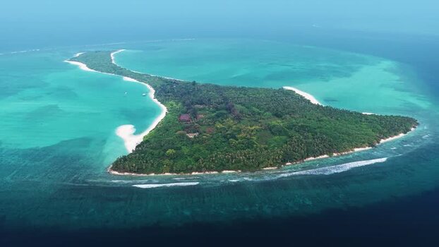 Aerial view of Vaikaradhoo island in the Maldives. Aerial view of Vaikaradhoo island in the Maldives.