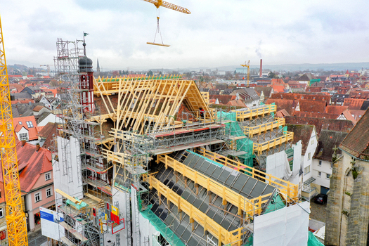 Aerial view of Rathaus Forchheim under renovation with scaffolding and wooden roof structures overlooking the historic rooftops Forchheim Bayern Germany. Aerial view of Rathaus Forchheim under renovation with scaffolding and wooden roof structures overlooking the historic rooftops Forchheim Bayern Germany.