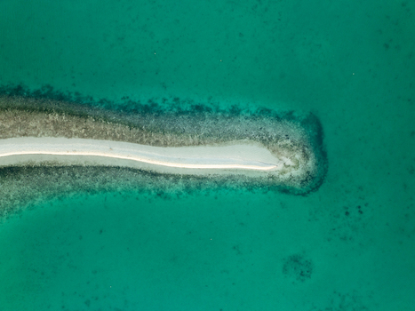 Aerial view of Pungtud sandbank surrounded by vibrant turquoise water and coral reef formations in Panglao Philippines. Aerial view of Pungtud sandbank surrounded by vibrant turquoise water and coral reef formations in Panglao Philippines.