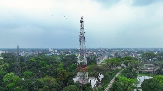 Aerial view of a telecommunications tower and lush greenery. Aerial view of a telecommunications tower and lush greenery.