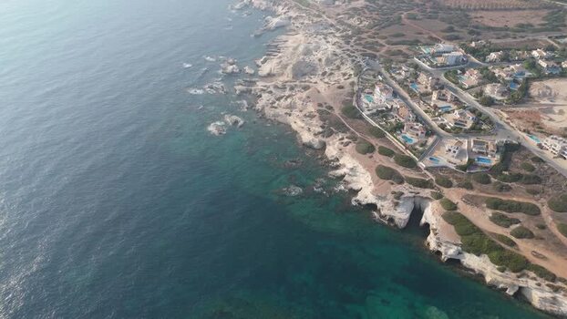 Aerial view of Mediterranean coastline and villas Cyprus.