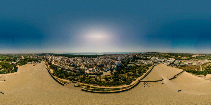 Aerial view of the Castle of Guardamar del Segura overlooking the town rooftops coastal pine forest and the Mediterranean Sea Guardamar del Segura Comunidad Valenciana Spain.