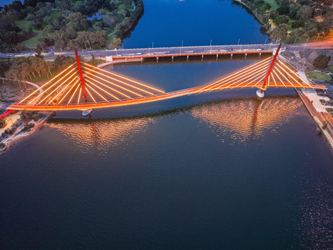 Aerial view of the illuminated Boorloo Bridge spanning the Swan River at night in East Perth Western Australia Australia.