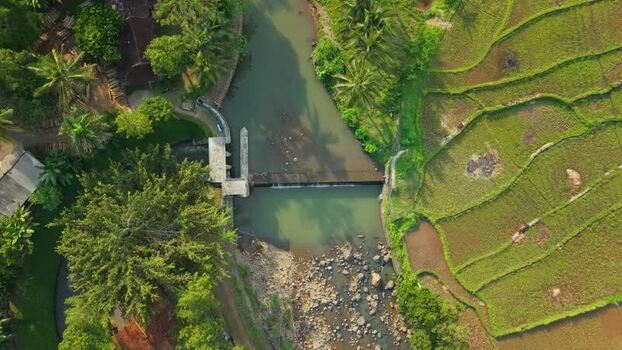 Aerial view of Tangsi River Water Gate and rice fields Indonesia. Aerial view of Tangsi River Water Gate and rice fields Indonesia.