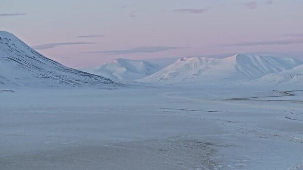 Aerial view of snowy arctic mountains in Svalbard and Jan Mayen. Aerial view of snowy arctic mountains in Svalbard and Jan Mayen.