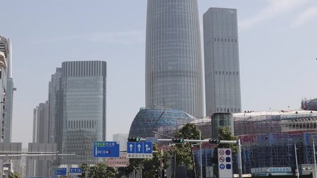 View of modern skyscrapers and urban street in Shenzhen China. View of modern skyscrapers and urban street in Shenzhen China.