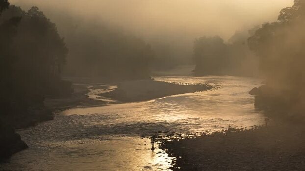 View of a misty river flowing through a foggy valley Nepal.