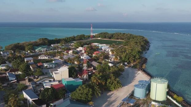 Aerial view of the tropical island village of Vashafaru Maldives. Aerial view of the tropical island village of Vashafaru Maldives.