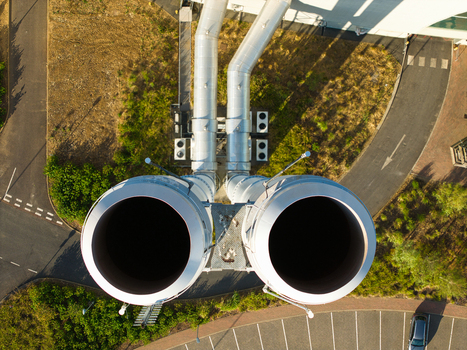 Aerial view of Energy Recovery Facility biomass to electricity featuring large industrial exhaust stacks and surrounding paved infrastructure in Bicester England United Kingdom.
