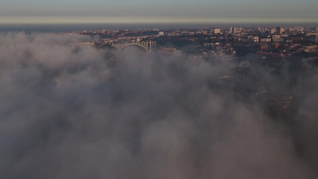 Aerial view of Arr&aacute;bida Bridge in the fog Portugal.