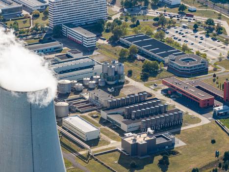 Aerial view of the Janschwalde power plant facility featuring a cooling tower industrial tanks and surrounding infrastructure in Peitz Brandenburg Germany. Aerial view of the Janschwalde power plant facility featuring a cooling tower industrial tanks and surrounding infrastructure in Peitz Brandenburg Germany.