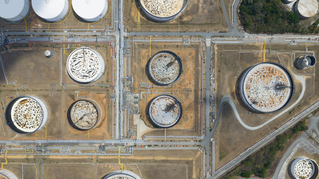 Aerial view of the Eastern Economic Corridor of Innovation EECi industrial facility with large storage tanks and complex piping systems in Tambon Pa Yup Nai Chang Wat Rayong Thailand. Aerial view of the Eastern Economic Corridor of Innovation EECi industrial facility with large storage tanks and complex piping systems in Tambon Pa Yup Nai Chang Wat Rayong Thailand.