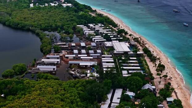 Aerial view of resort buildings along the coastline Indonesia.
