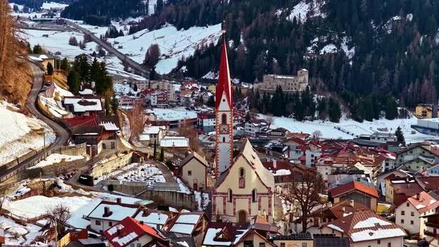 Aerial view of Nauders church and village in winter Austria.