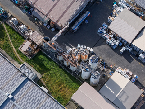 Melbourne VIC Australia 22 September 2026 Aerial view of industrial factories in Kilsyth featuring large storage tanks metal rooftops and shipping containers in an urban manufacturing zone. Melbourne VIC Australia 22 September 2026 Aerial view of industrial factories in Kilsyth featuring large storage tanks metal rooftops and shipping containers in an urban manufacturing zone.