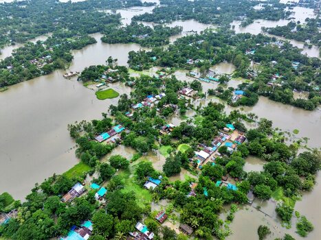 Banshkhali Upazila Chittagong Division Bangladesh 10 July 2026 Aerial view of a flooded village with houses partially submerged in water surrounded by lush green trees. Banshkhali Upazila Chittagong Division Bangladesh 10 July 2026 Aerial view of a flooded village with houses partially submerged in water surrounded by lush green trees.