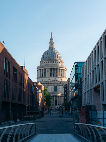 London United Kingdom 21 June 2025 View of the magnificent St. Paul s Cathedral dome rising majestically between modern buildings a symphony of old and new against a clear sky. London United Kingdom 21 June 2025 View of the magnificent St. Paul s Cathedral dome rising majestically between modern buildings a symphony of old and new against a clear sky.