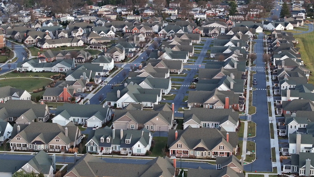 Aerial view of a suburban residential neighborhood with rows of houses paved streets and green lawns in Lititz Pennsylvania United States.