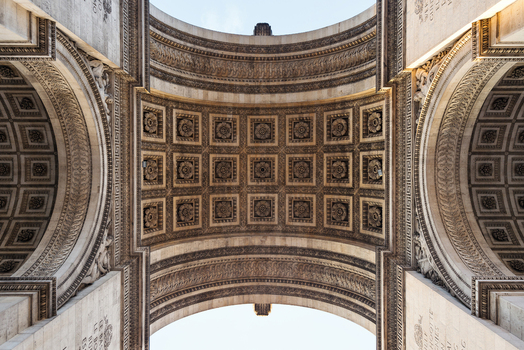View of the intricate coffered ceiling and ornate stone carvings of the Arc de Triomphe Paris Ile de France France.