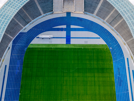 Berlin Germany 26 September 2026 Aerial view of Olympiastadion Berlin with its distinctive blue running track and vibrant green football pitch.