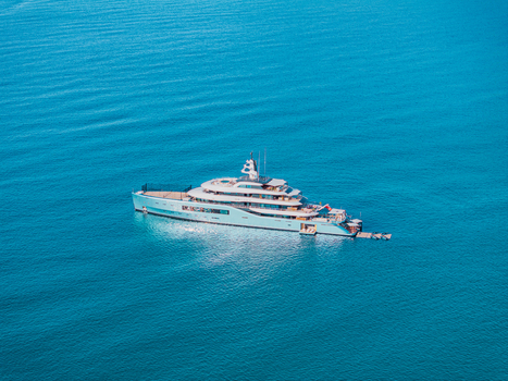 Aerial view of luxury yacht Netto II anchored in the turquoise waters of Lacona Bay off the coast of Elba Lacona Tuscany Italy.