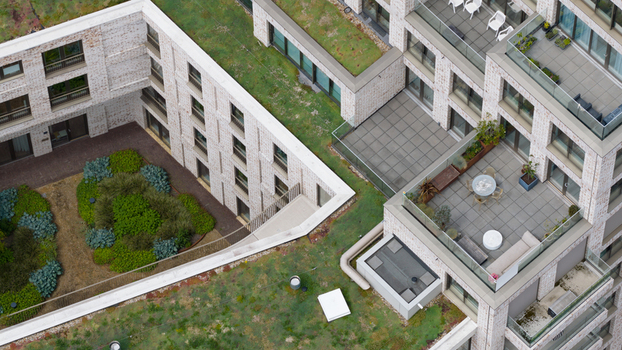 Aerial view of modern apartment buildings with green roofs and private terraces at Cruquiusweg in Amsterdam Noord Holland Netherlands.