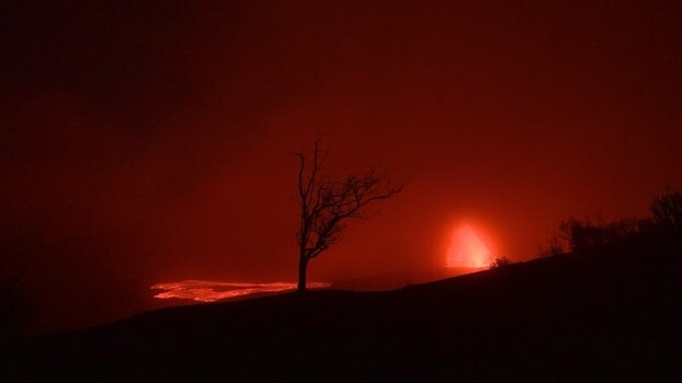 View of Halemaumau Crater with glowing lava at night United States.