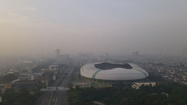 Aerial view of Patriot Candrabhaga Stadium surrounded by urban sprawl and dense greenery in Bekasi Barat West Java Indonesia. Aerial view of Patriot Candrabhaga Stadium surrounded by urban sprawl and dense greenery in Bekasi Barat West Java Indonesia.