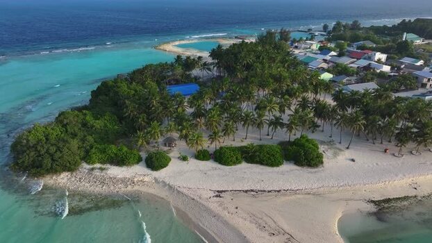 Aerial view of a tropical island with palm trees Maldives. Aerial view of a tropical island with palm trees Maldives.
