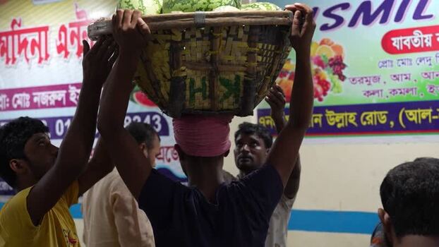 View of workers carrying watermelons at Sadarghat Bangladesh.