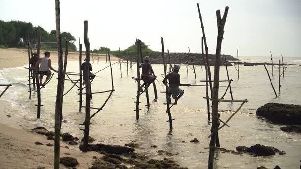 View of stilt fishermen in the ocean in Koggala Sri Lanka. View of stilt fishermen in the ocean in Koggala Sri Lanka.