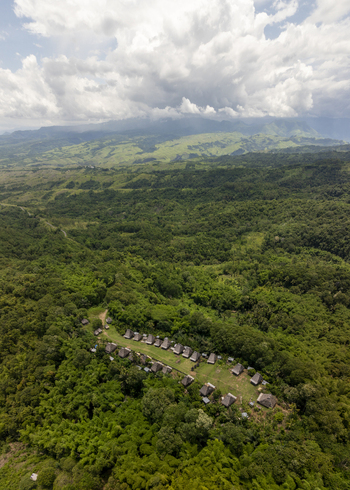 Aerial view of Kampung Adat Belaraghi a traditional village with thatched roof houses nestled in the lush green forests of Kecamatan Aimere Nusa Tenggara Timur Indonesia. Aerial view of Kampung Adat Belaraghi a traditional village with thatched roof houses nestled in the lush green forests of Kecamatan Aimere Nusa Tenggara Timur Indonesia.